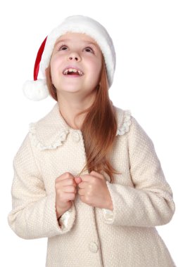 Noel Baba şapkası içinde güzel çocuk mutlu ve gülüyor