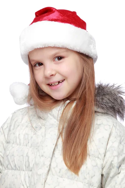 Portrait d'une fille joyeuse avec un chapeau de Père Noël — Photo