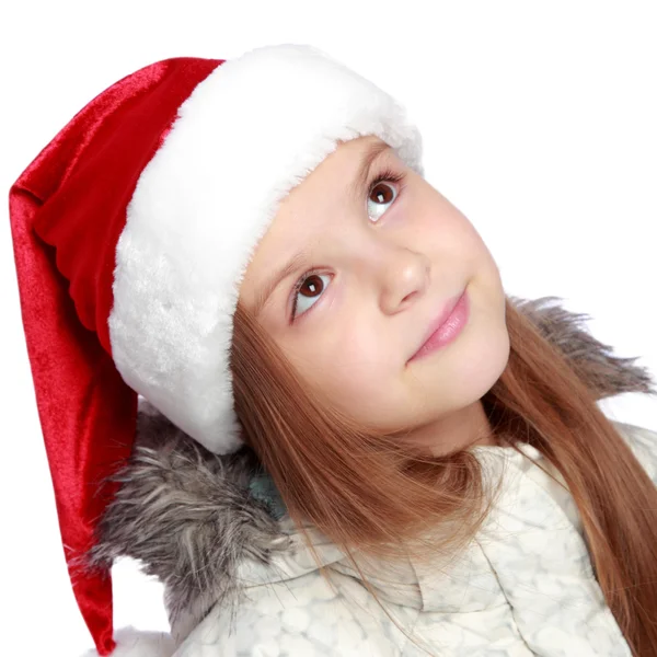 Portrait de vacances d'une fille joyeuse avec un chapeau de Père Noël — Photo