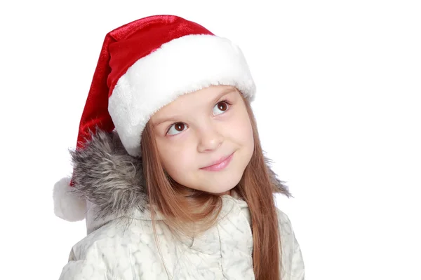 Retrato de férias de uma menina alegre com um chapéu de Papai Noel — Fotografia de Stock