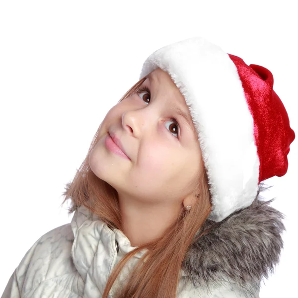 Retrato navideño de una chica alegre con sombrero de Santa —  Fotos de Stock