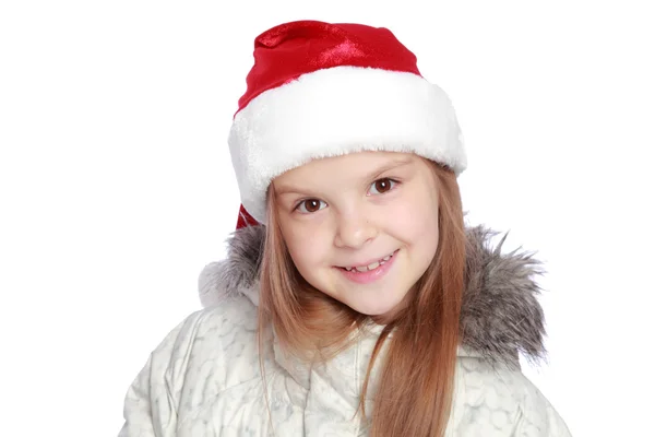 Retrato navideño de una chica alegre con sombrero de Santa —  Fotos de Stock