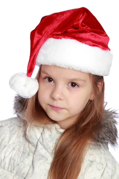 Retrato navideño de una chica alegre con sombrero de Santa —  Fotos de Stock