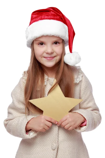 Ritratto natalizio di un bambino carino con il cappello di Babbo Natale — Foto Stock