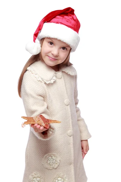 Weihnachtsporträt eines süßen Kindes mit Weihnachtsmannmütze — Stockfoto