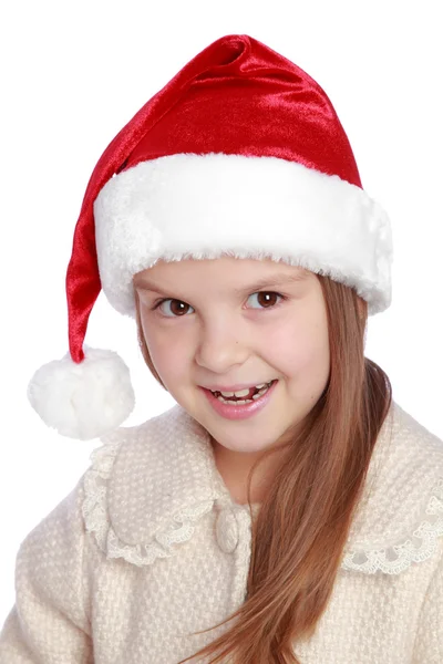 Noel Baba şapkası içinde güzel çocuk mutlu ve gülüyor