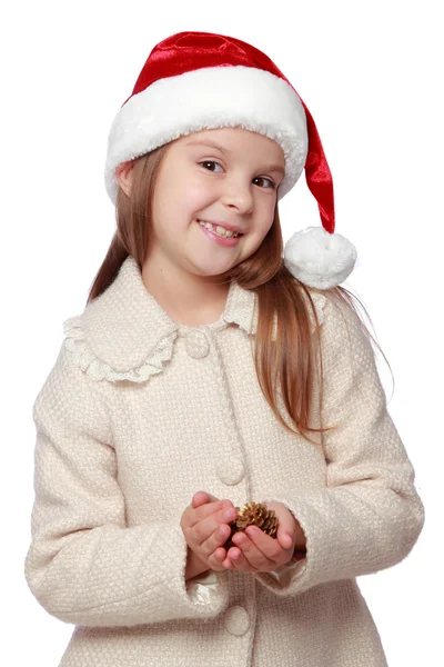 Mooie kind in een kerstmuts is blij en lacht — Stockfoto