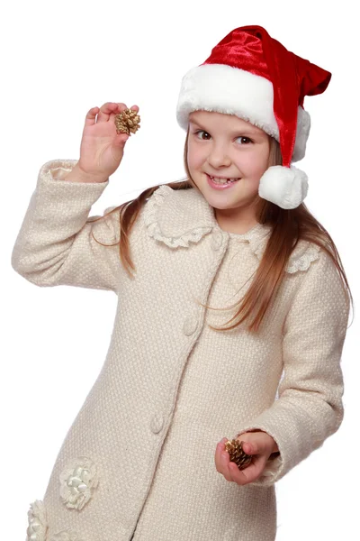Niño encantador en un sombrero de Santa es feliz y se ríe — Foto de Stock