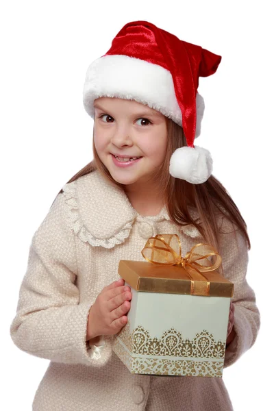 Lovely child in a Santa hat is happy and laughs — Stock Photo, Image