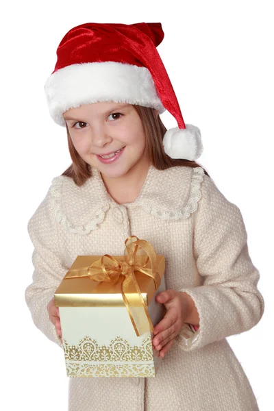 Niño encantador en un sombrero de Santa es feliz y se ríe —  Fotos de Stock