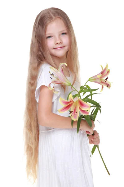 Kid with flowers — Stock Photo, Image