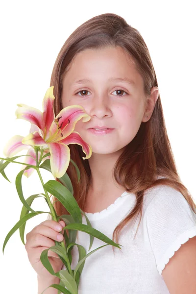 Vackra leende flicka med en Lilja — Stockfoto