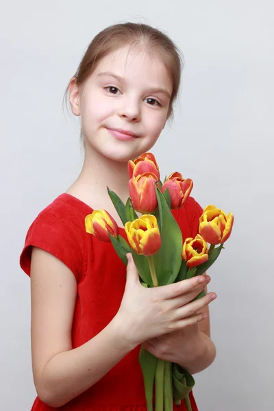 Kid with flowers — Stock Photo, Image