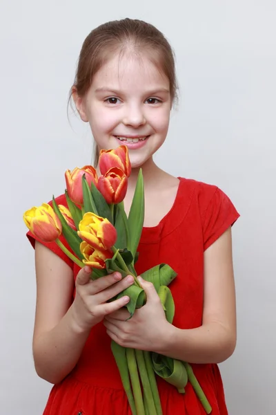 Kid with flowers — Stock Photo, Image