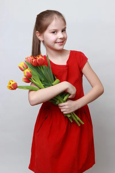 Kid with flowers — Stock Photo, Image