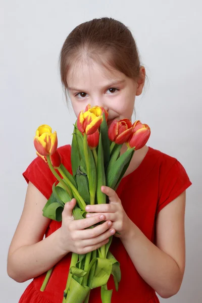 Kid with flowers — Stock Photo, Image