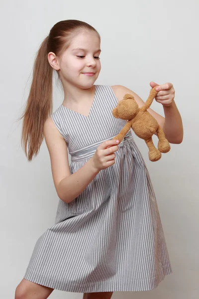 Kid holding toy bear — Stock Photo, Image