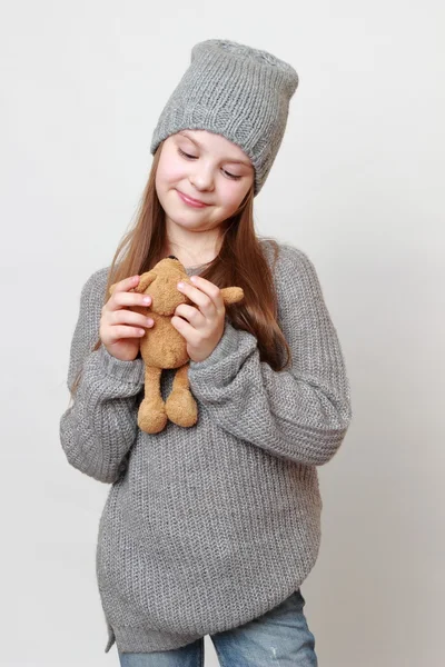 Kid holding toy bear — Stock Photo, Image