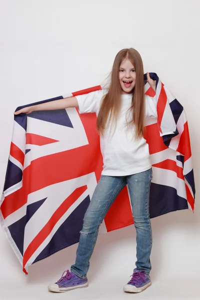 Niño sosteniendo bandera simbólica — Foto de Stock