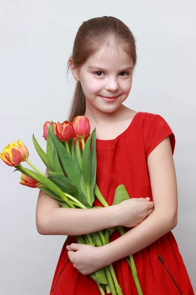 Kid and flowers — Stock Photo, Image