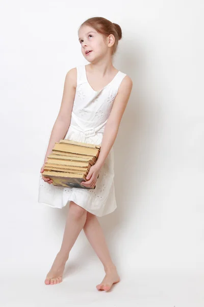 Kid holding vintage books — Stock Photo, Image