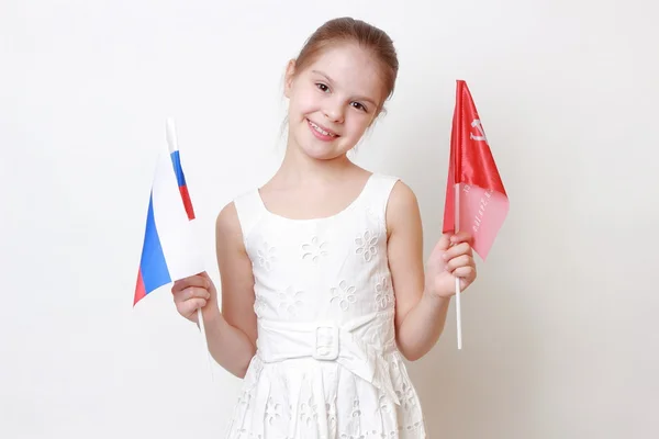 Kid holding symbolic flag — Stock Photo, Image