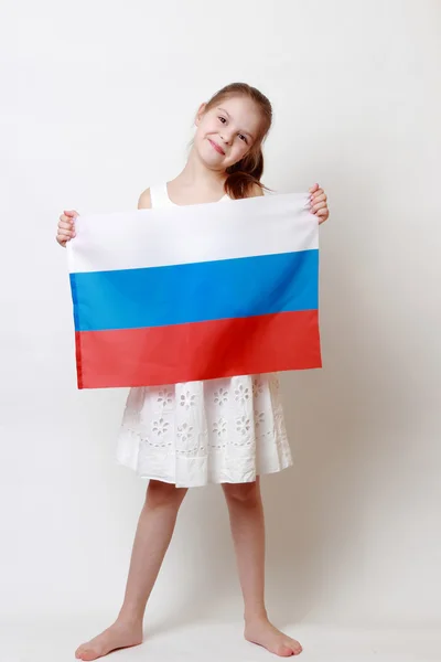 Kid holding symbolic flag — Stock Photo, Image