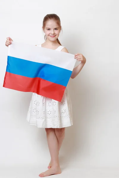 Kid holding symbolic flag — Stock Photo, Image