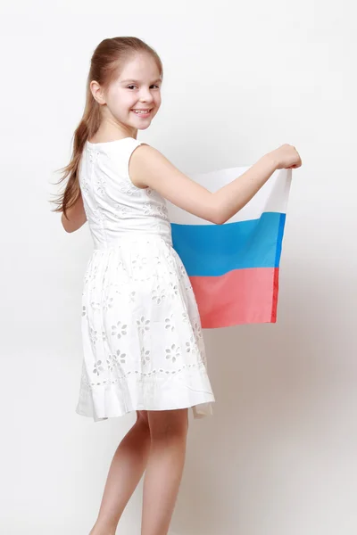 Kid holding symbolic flag — Stock Photo, Image