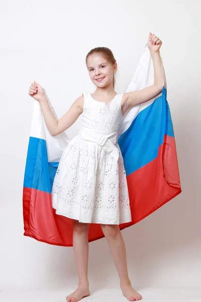 Dziecko trzyma symboliczne flagi — Zdjęcie stockowe