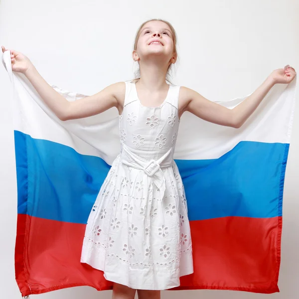 Kid holding symbolic flag — Stock Photo, Image