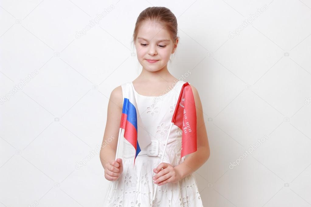 Kid holding symbolic flag