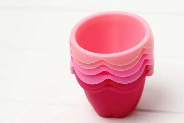 Pink tins for baking muffins — Stock Photo, Image