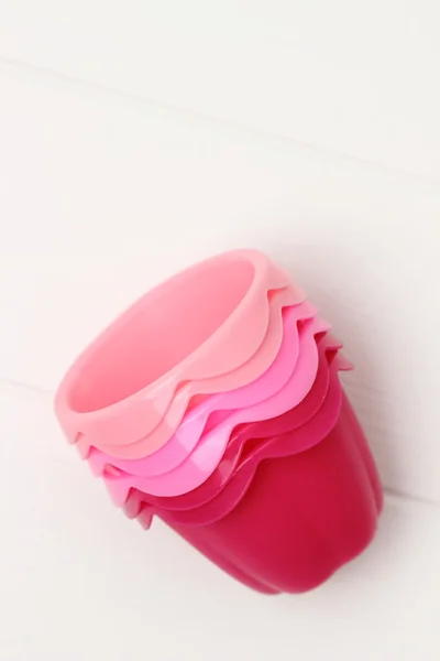 Pink tins for baking muffins — Stock Photo, Image