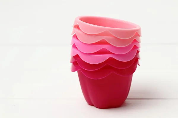 Pink tins for baking muffins — Stock Photo, Image