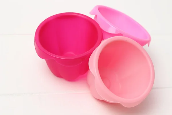 Pink tins for baking muffins — Stock Photo, Image