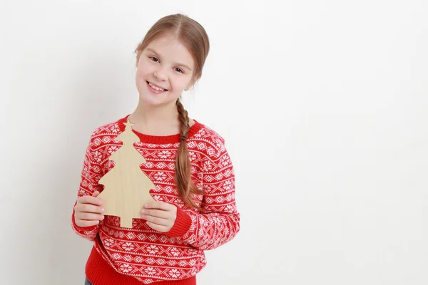 Teen girl holding Christmas decoration — Stock Photo, Image