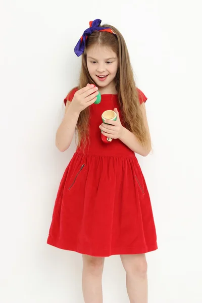 Kid holding matryoshka doll — Stock Photo, Image