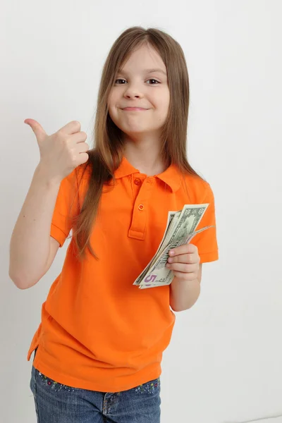Sorridente menina e dinheiro — Fotografia de Stock