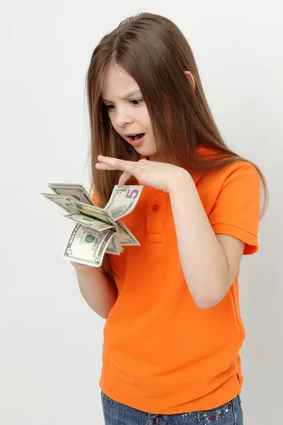 Sonriente niña y dinero — Foto de Stock