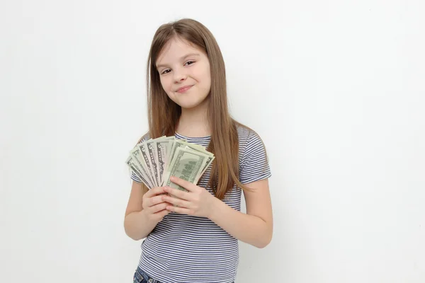 Little girl and dollars — Stock Photo, Image