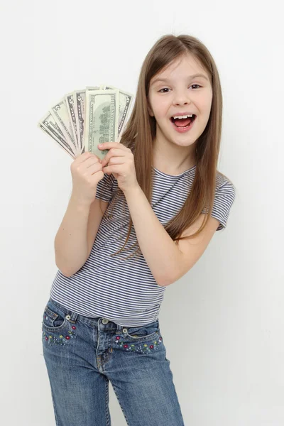 Klein meisje en dollars — Stockfoto
