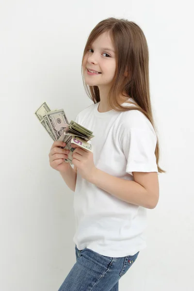 Little girl and dollars — Stock Photo, Image