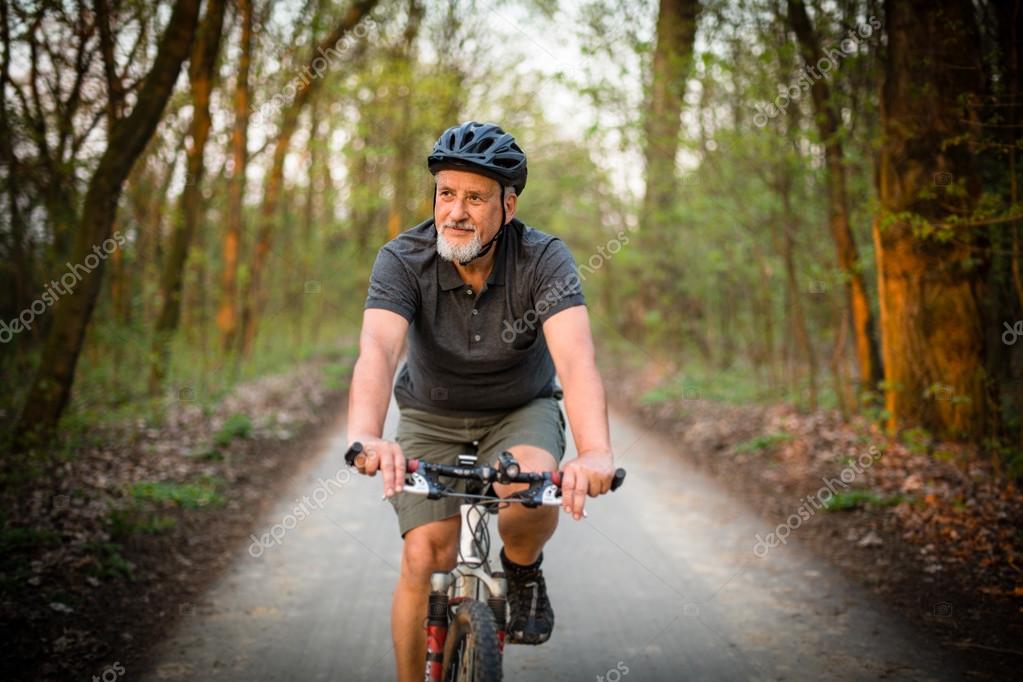 Senior man on his mountain bike outdoors — Stock Photo © lightpoet