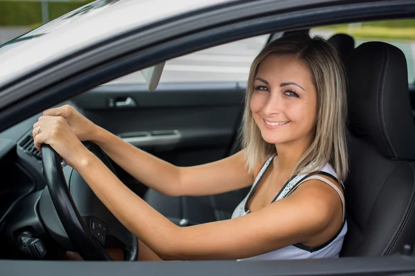 Woman driving a car - female driver at a wheel of a modern car, — Stock Photo, Image