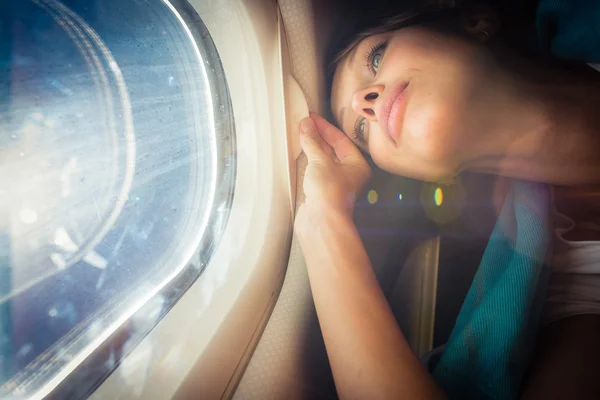 Happy, female airplane passanger