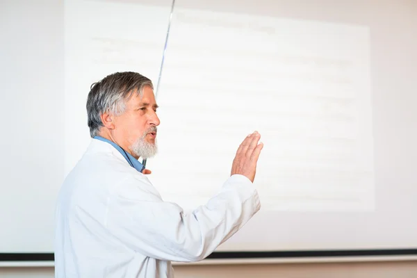 Senior chemistry professor giving a lecture — Stock Photo, Image