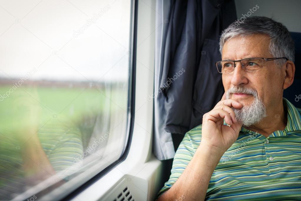 Senior man enjoying a train travel