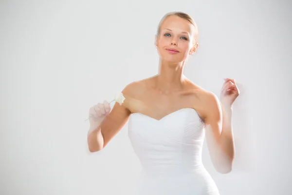 Bride dancing, holding a rose — Stock Photo, Image