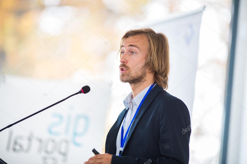 Man giving a speech at a conference